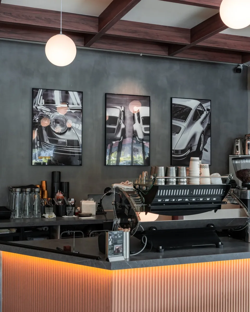 Cafe counter under the Porsche prints